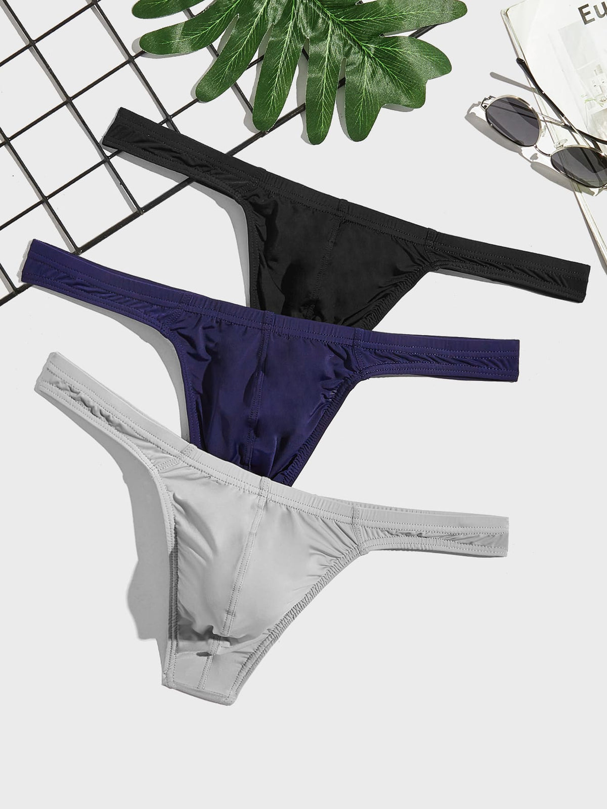 3-pack of men's low-rise solid color thongs made from high-stretch polyamide blend fabric