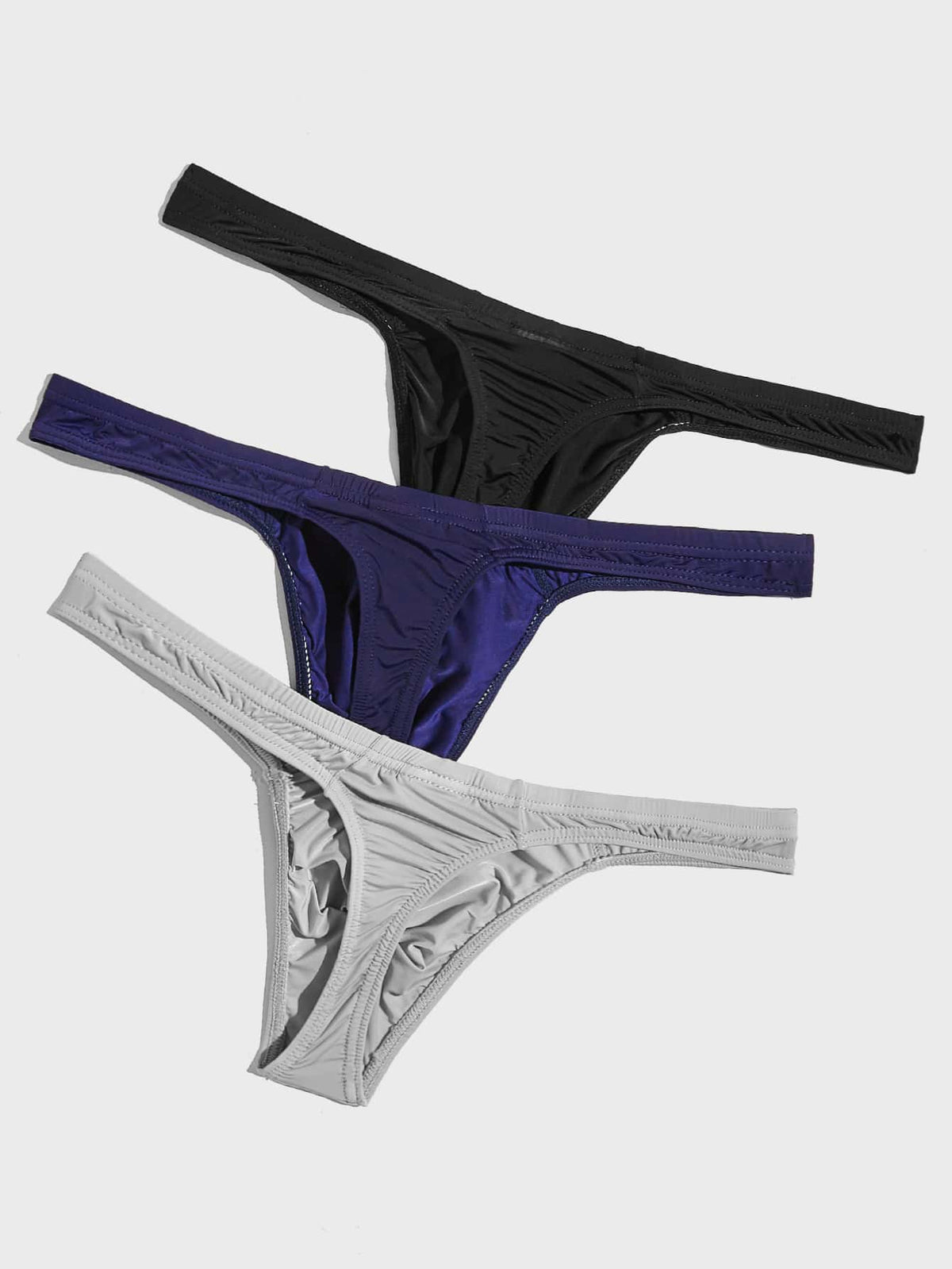 3-pack of men's low-rise solid color thongs made from high-stretch polyamide blend fabric