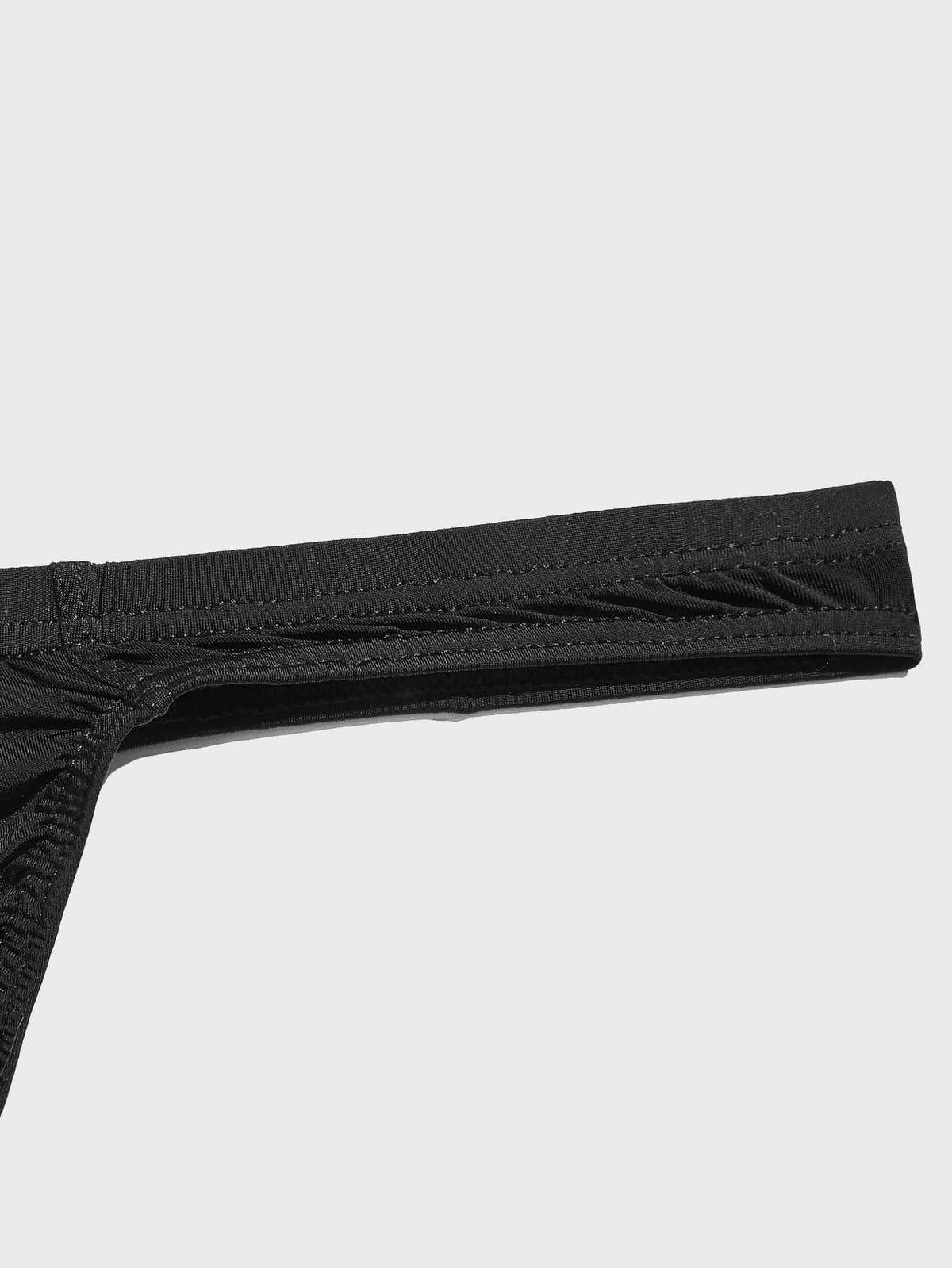 3-pack of men's low-rise solid color thongs made from high-stretch polyamide blend fabric