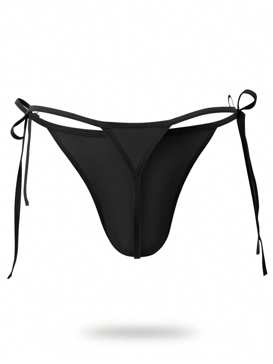 Men's black knitted fabric low-rise thong underwear featuring knot detail.