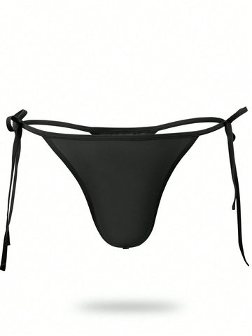 Men's black knitted fabric low-rise thong underwear featuring knot detail.