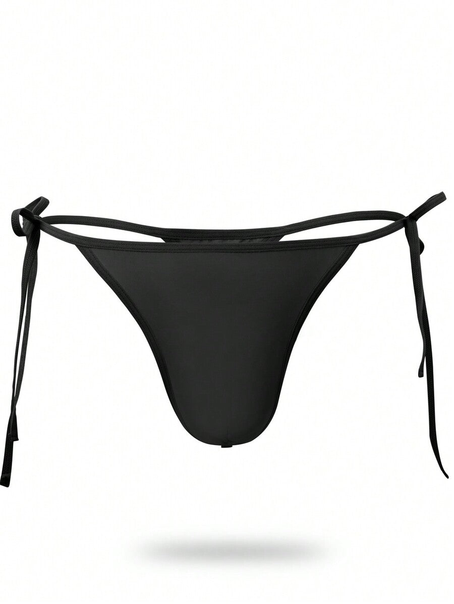 Men's black knitted fabric low-rise thong underwear featuring knot detail.