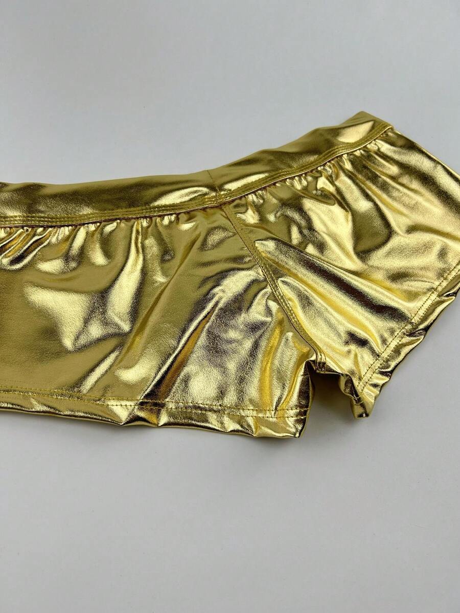 Gold men's glossy stage reflective faux leather trunks featuring mid-rise waistband and stretch fabric.