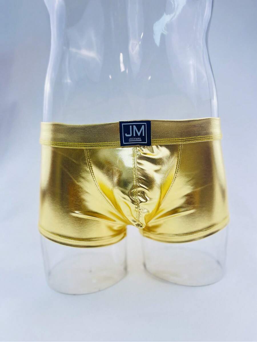Gold men's glossy stage reflective faux leather trunks featuring mid-rise waistband and stretch fabric.