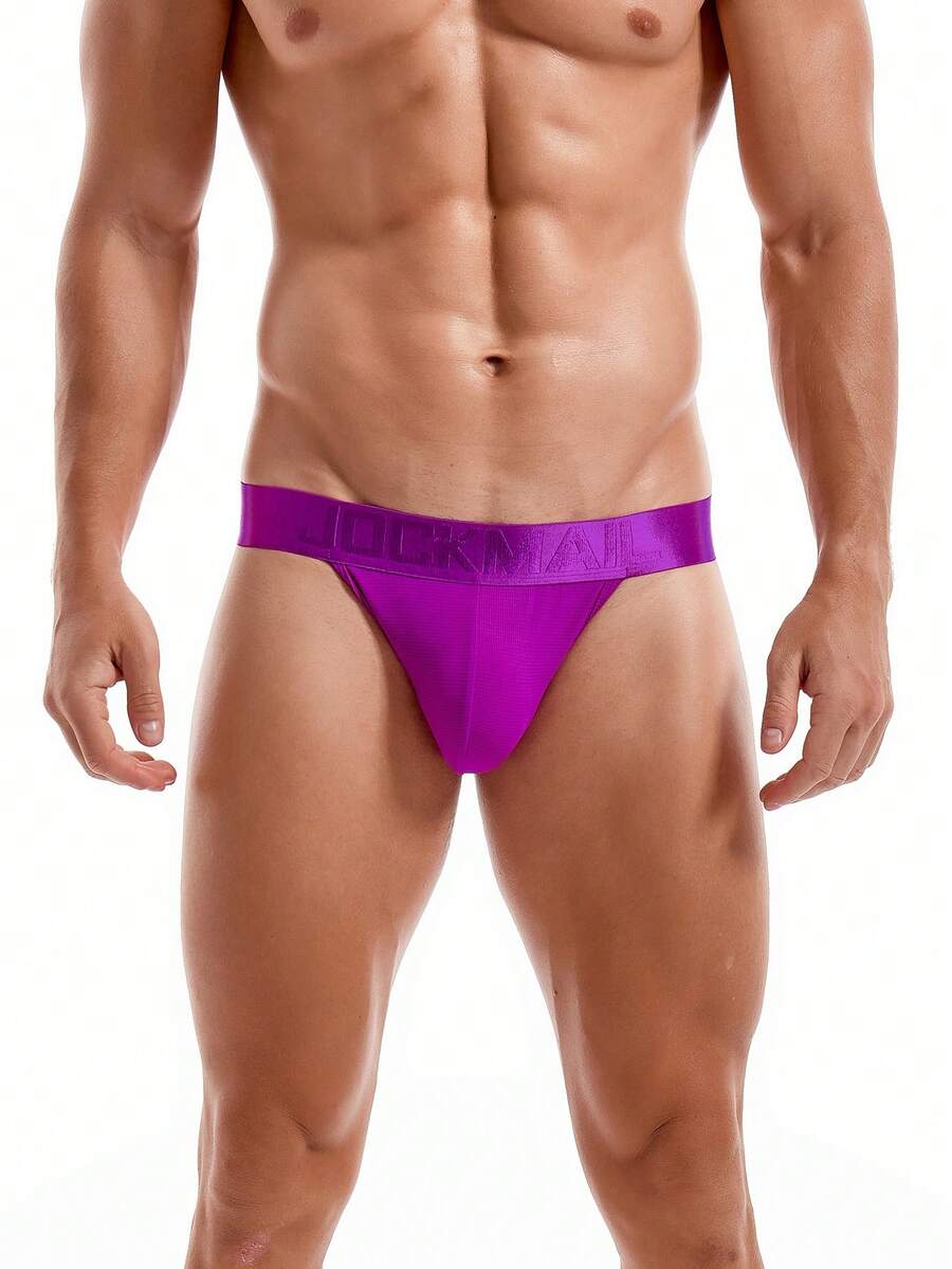 Pink men's low rise thong underwear featuring a minimalist sports brief cut and medium stretch fabric.