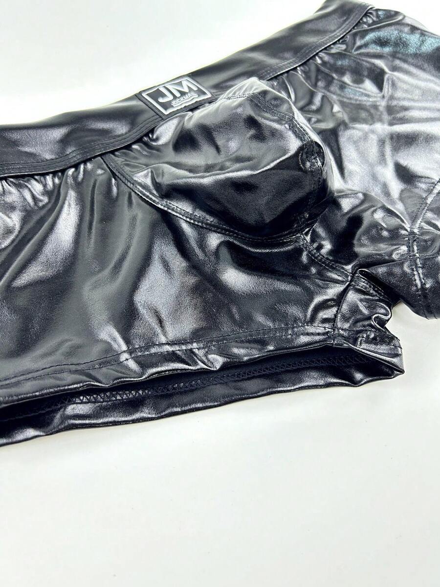 Gold men's glossy stage reflective faux leather trunks featuring mid-rise waistband and stretch fabric.