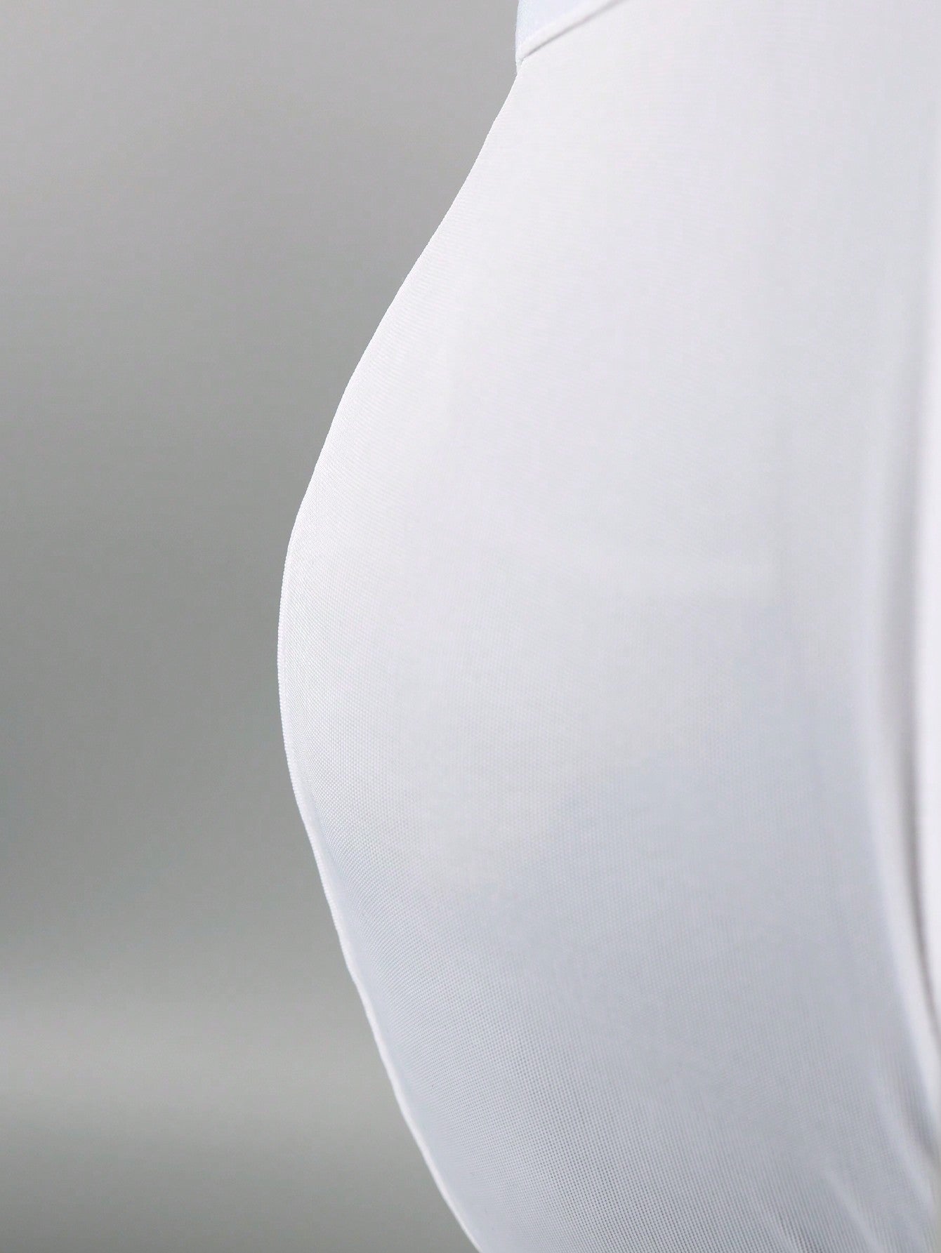 Men's white G-string underwear in knitted fabric with tape detail, mid-rise fit, and medium stretch for daily wear.