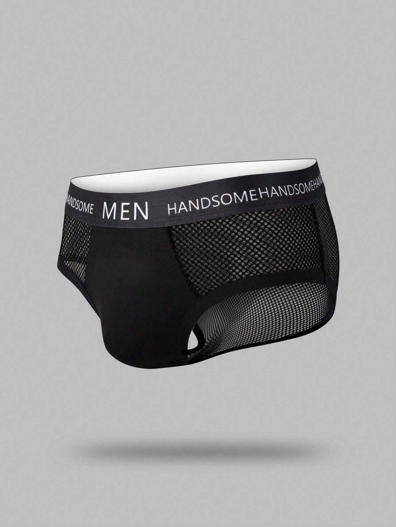 Black men's low rise briefs with cut out detail, letter elastic waistband, and medium-stretch knitted polyamide blend.