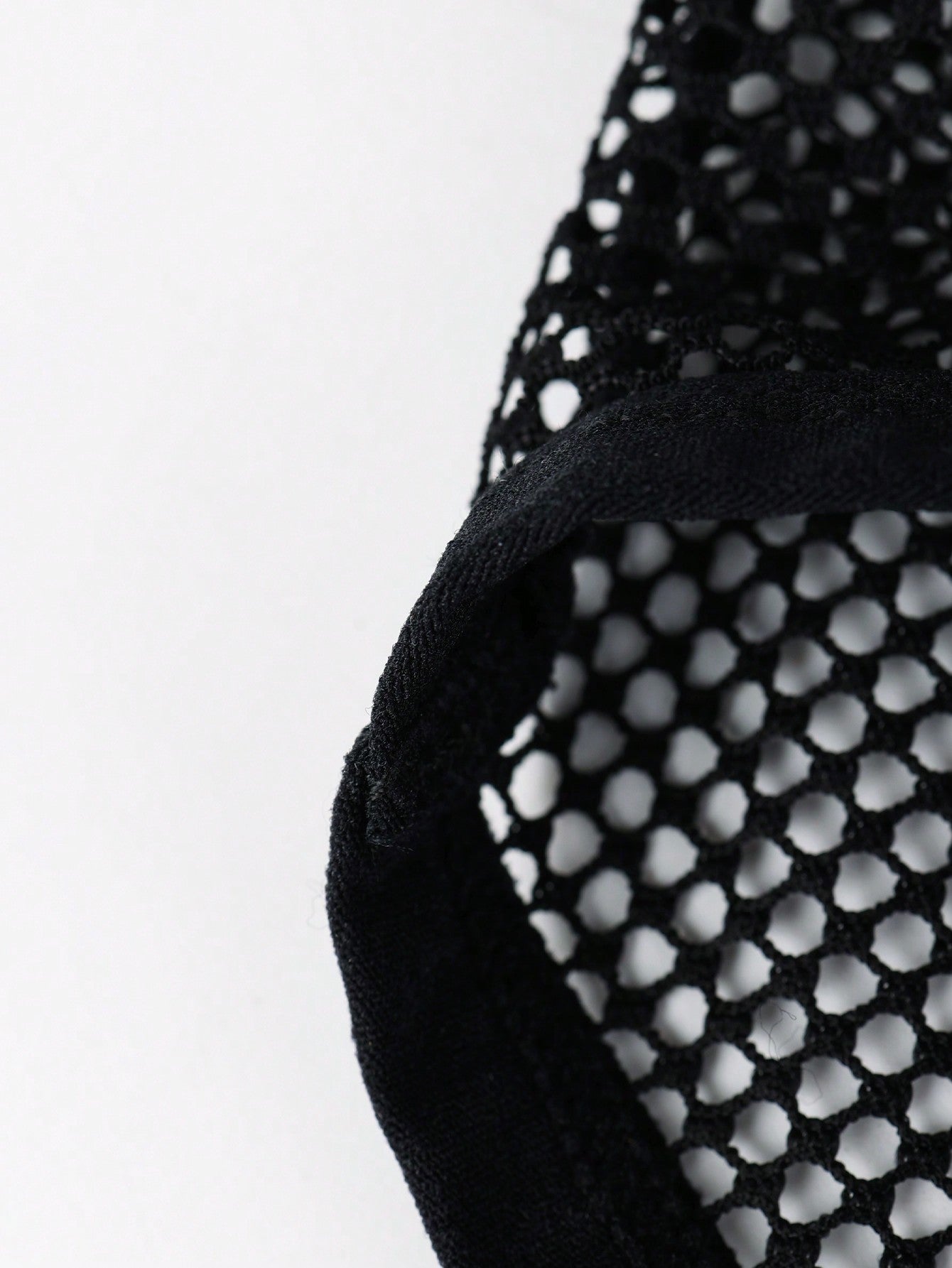 Black men's low rise briefs with cut out detail, letter elastic waistband, and medium-stretch knitted polyamide blend.