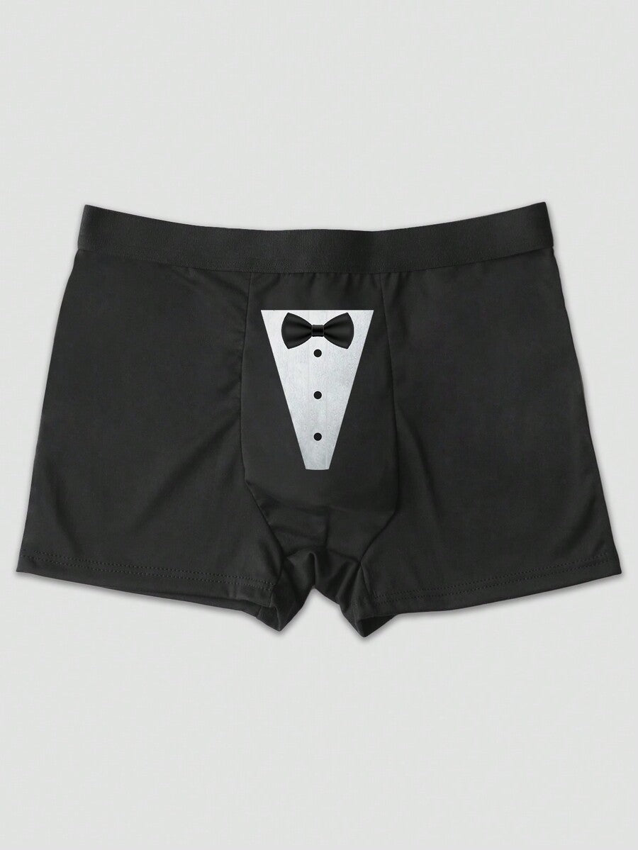 Two pairs of men's black graphic briefs with mid-rise waist, colorblock design, and high stretch fabric.