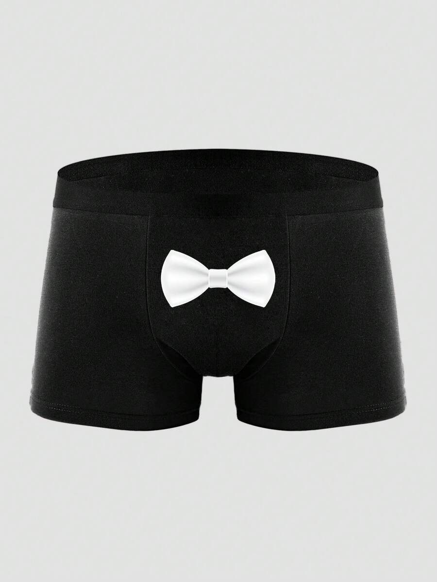 Two pairs of men's black graphic briefs with mid-rise waist, colorblock design, and high stretch fabric.