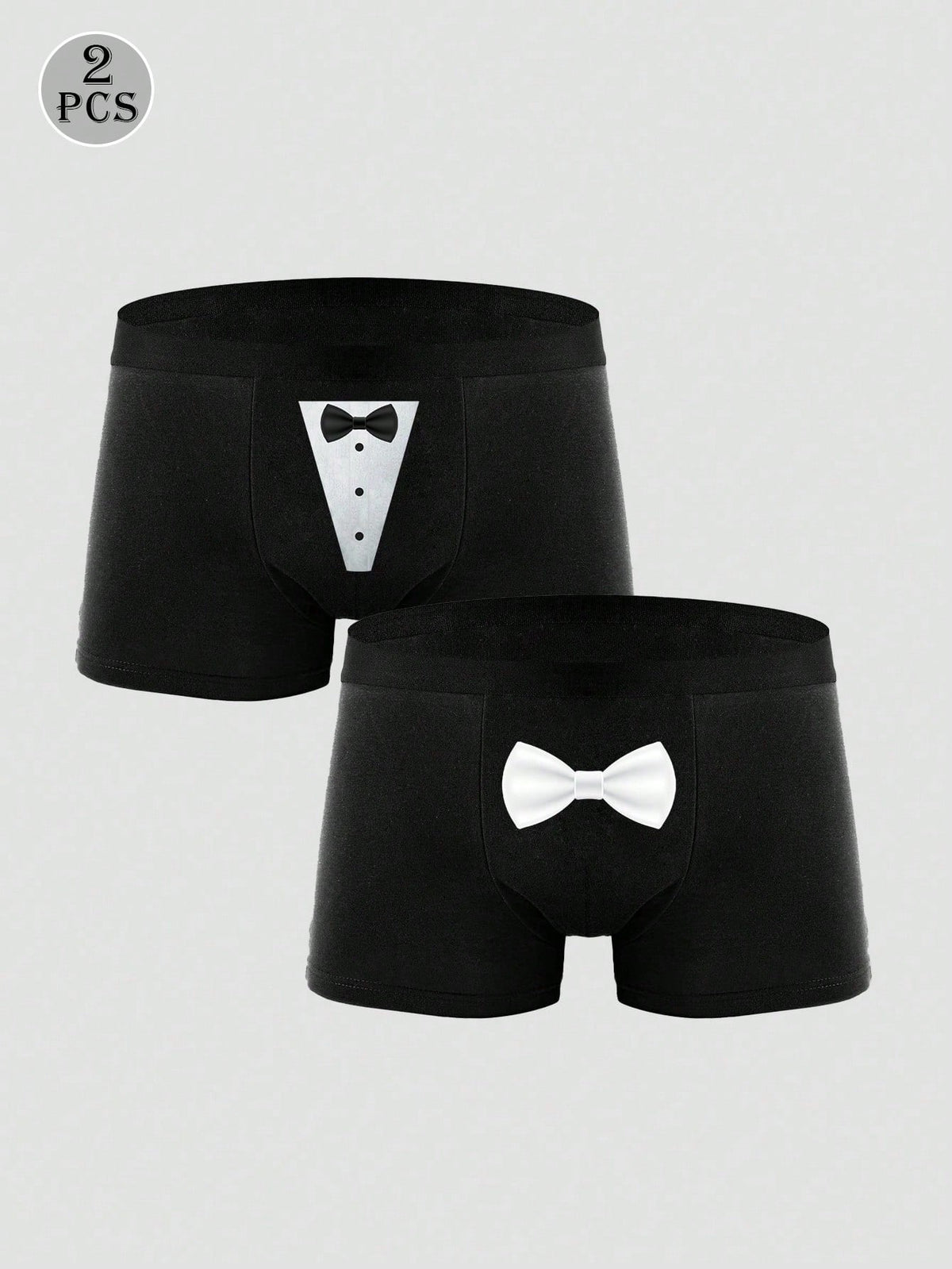 Two pairs of men's black graphic briefs with mid-rise waist, colorblock design, and high stretch fabric.