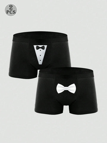 Two pairs of men's black graphic briefs with mid-rise waist, colorblock design, and high stretch fabric.
