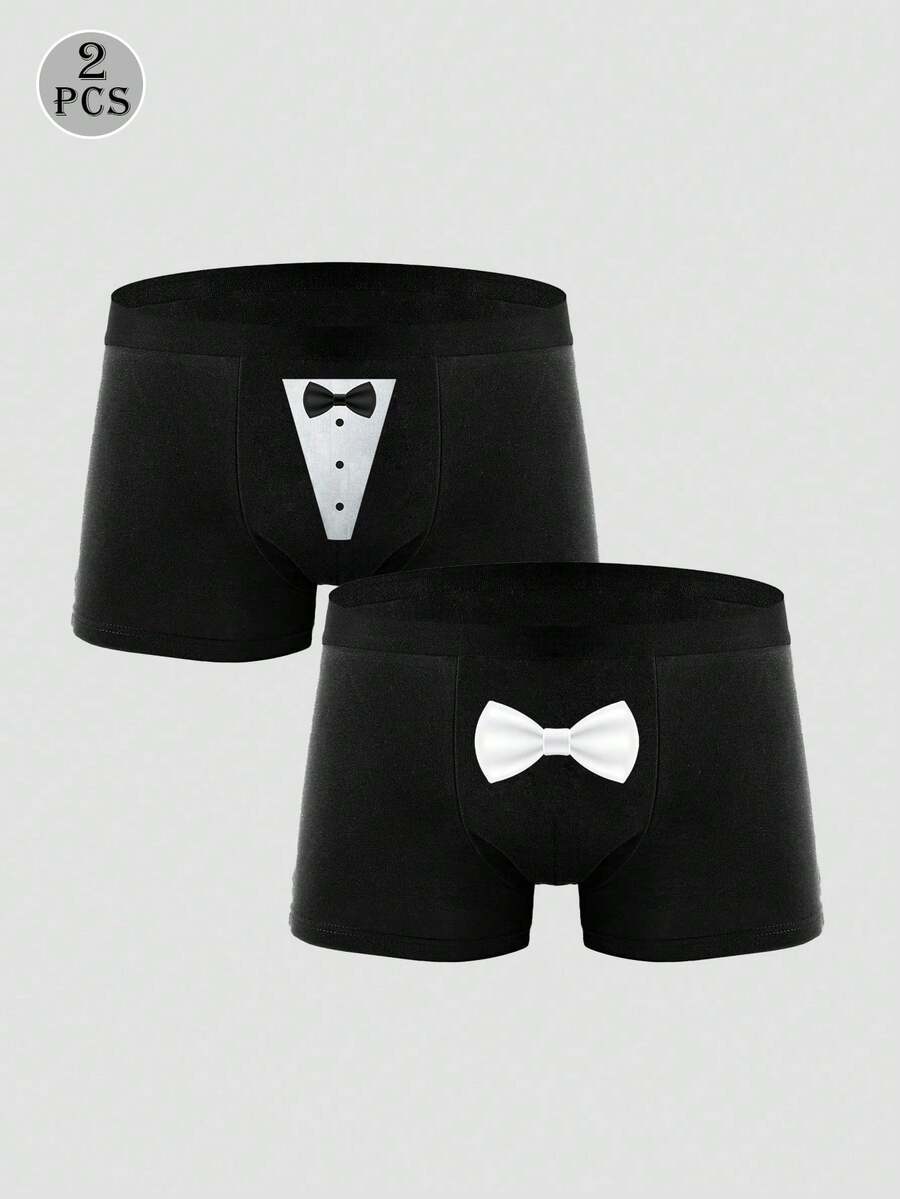 Two pairs of men's black graphic briefs with mid-rise waist, colorblock design, and high stretch fabric.