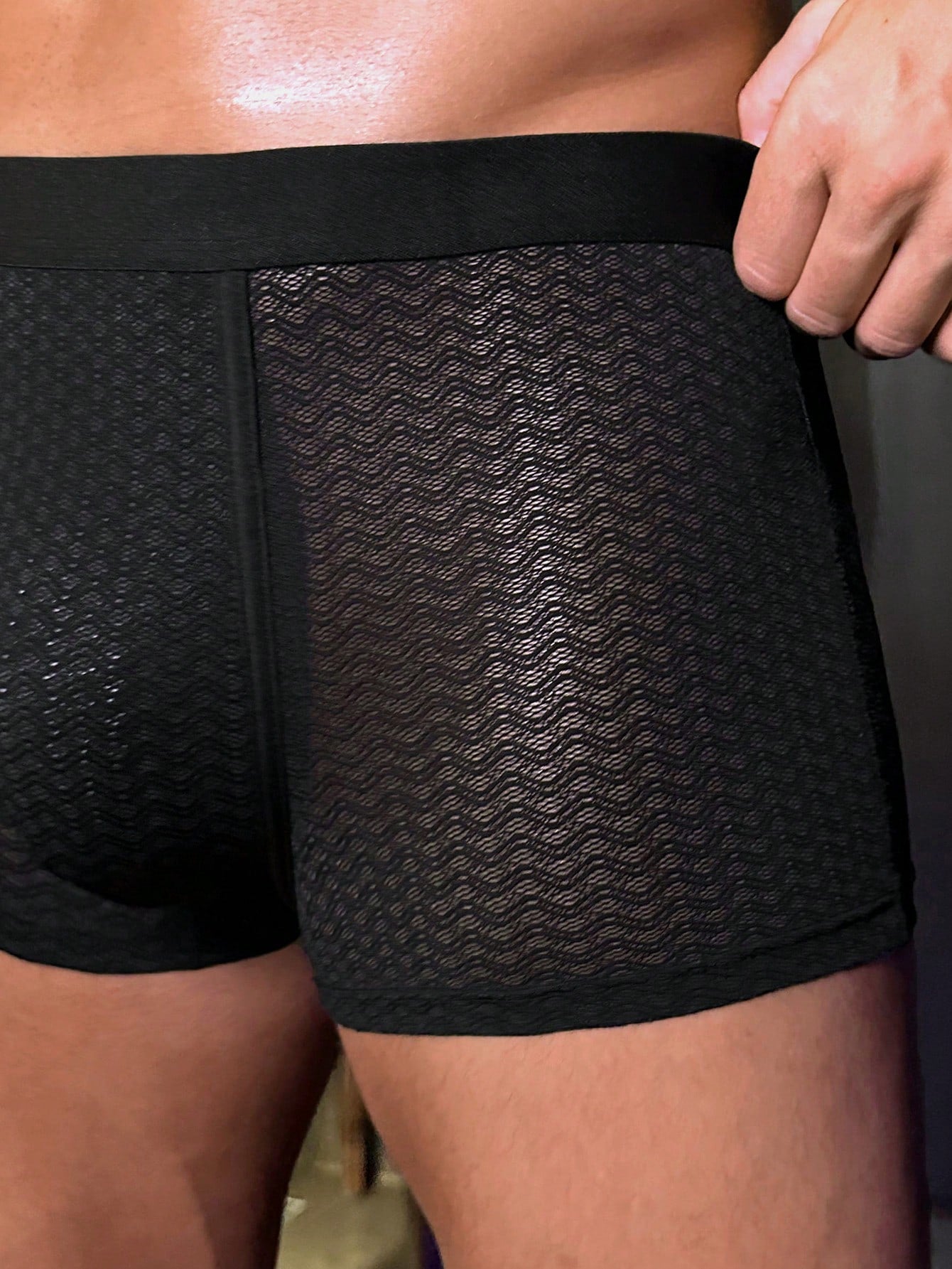 Men's solid color boxer shorts underwear with contrast mesh detail, high-rise waist, and medium-stretch knitted fabric in a minimalist style for casual daily wear.