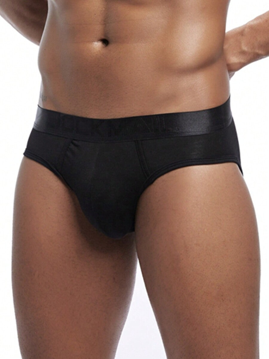 Men's low rise sporty briefs in solid color featuring soft modal fabric with tape details.