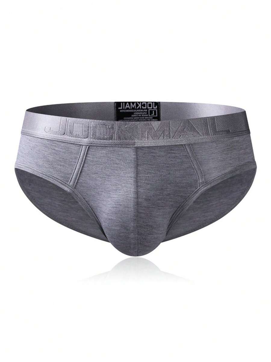Men's low rise sporty briefs in solid color featuring soft modal fabric with tape details.