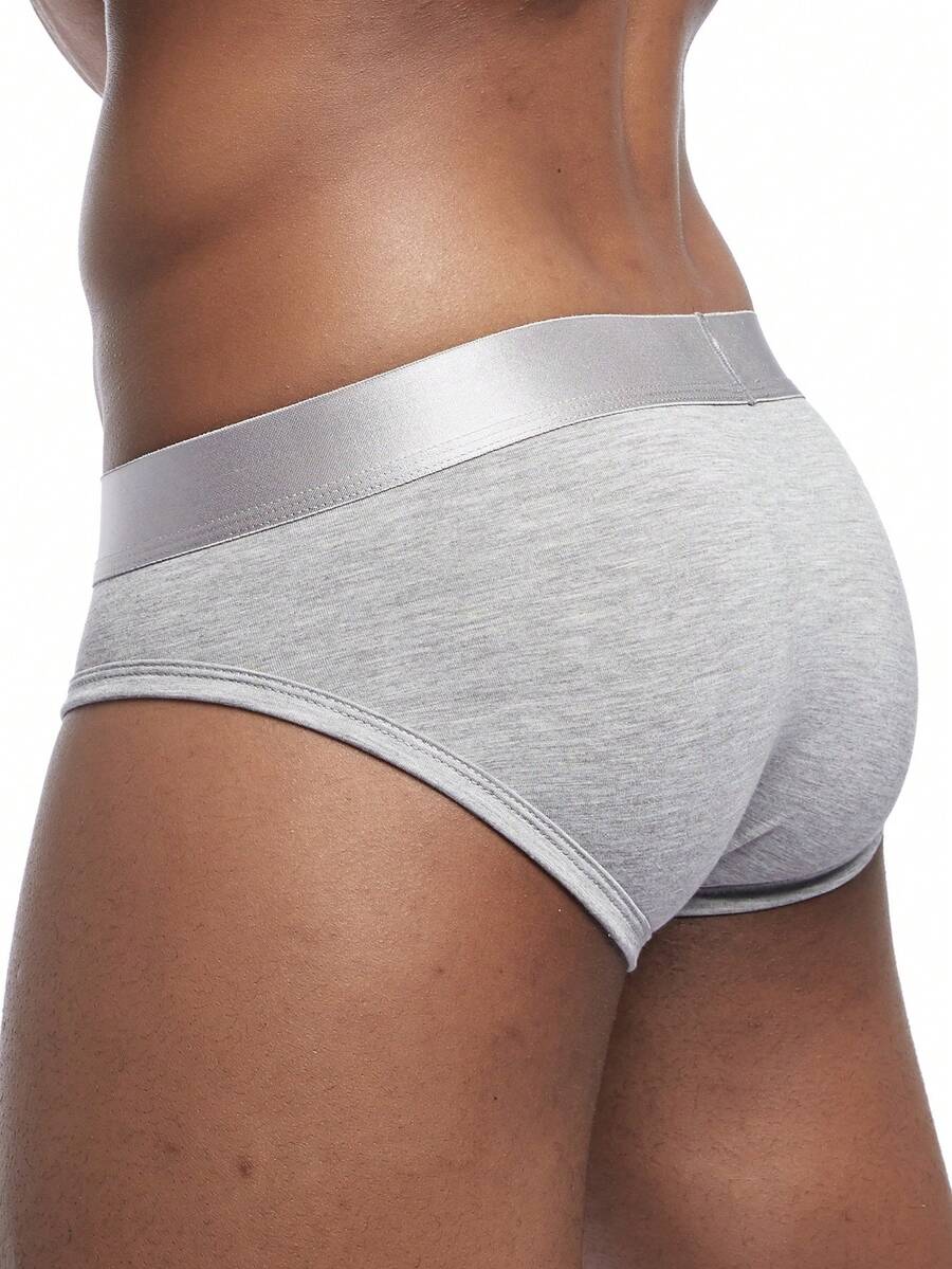 Men's low rise sporty briefs in solid color featuring soft modal fabric with tape details.