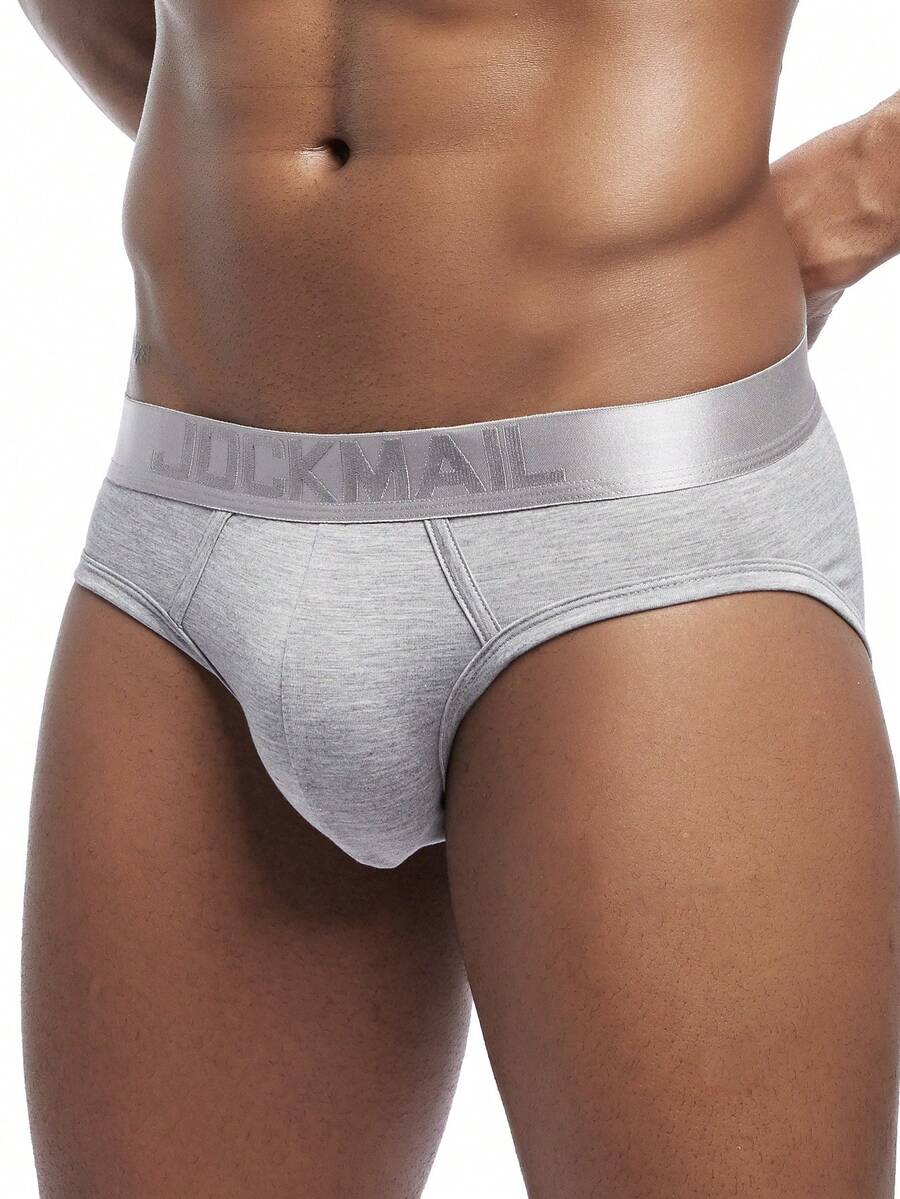 Men's low rise sporty briefs in solid color featuring soft modal fabric with tape details.