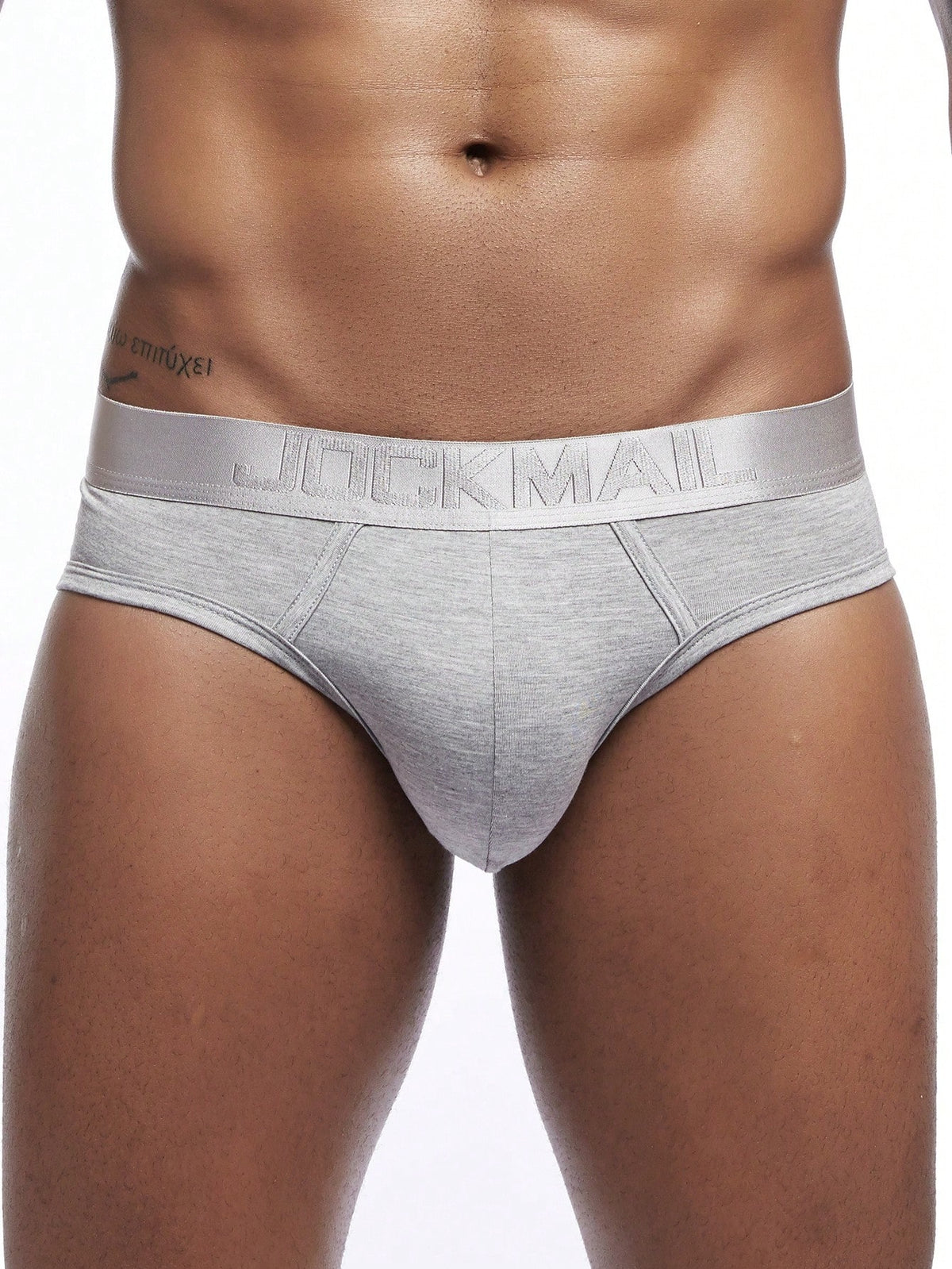 Men's low rise sporty briefs in solid color featuring soft modal fabric with tape details.