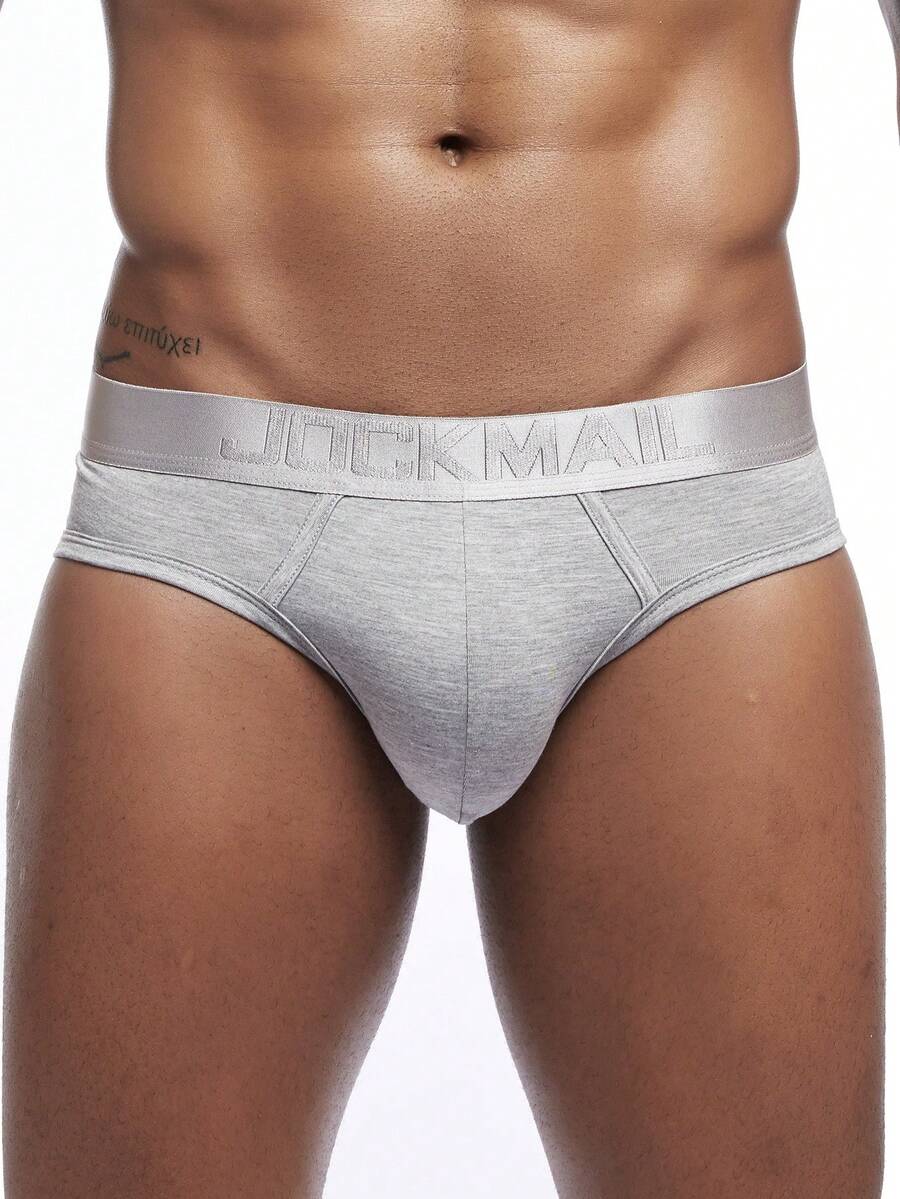 Men's low rise sporty briefs in solid color featuring soft modal fabric with tape details.