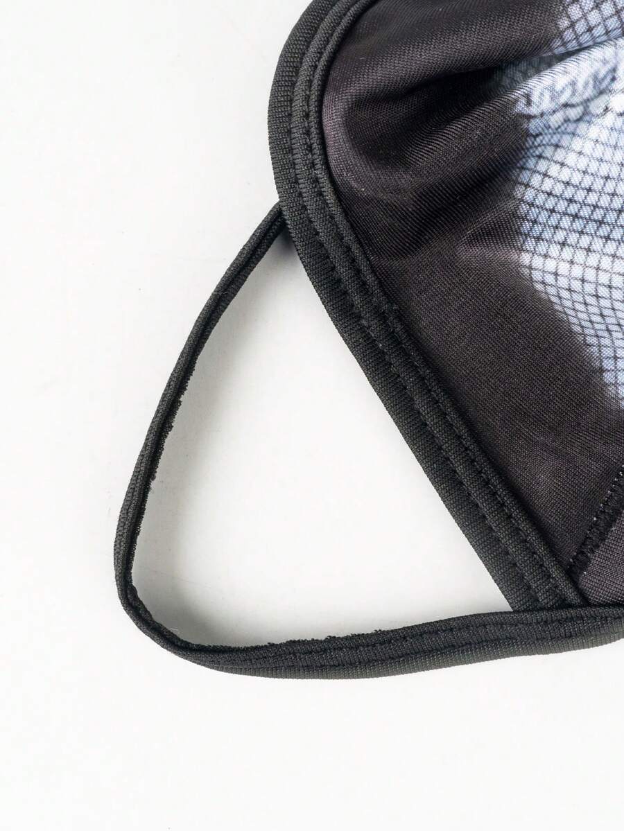 Multicolor men's Halloween thong briefs featuring contrast binding, tape details, and a mid-rise waist.