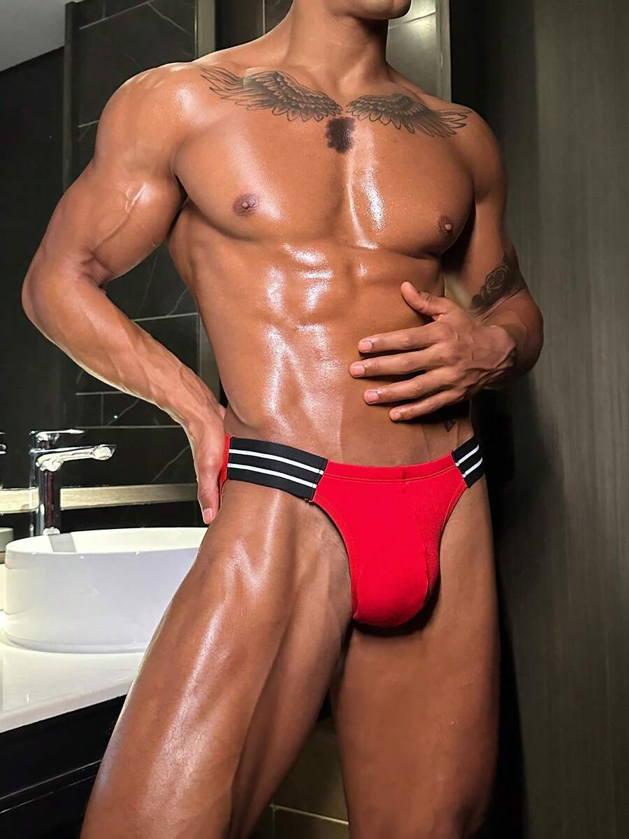 Men's low rise cut out briefs made from knitted stretch viscose fabric featuring colorblock design.