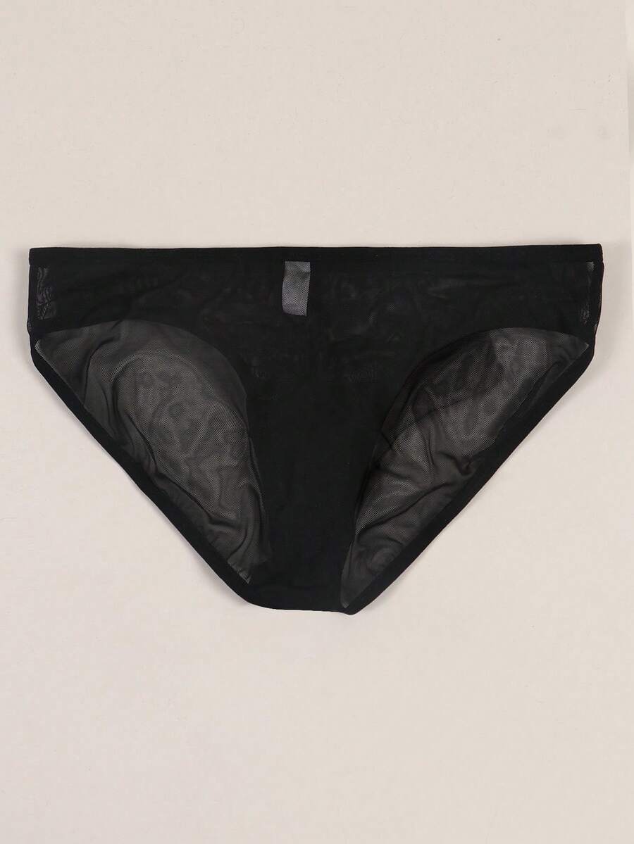 Black semi-sheer mesh thong underwear for men featuring a heart eye print pattern and low-rise fit.