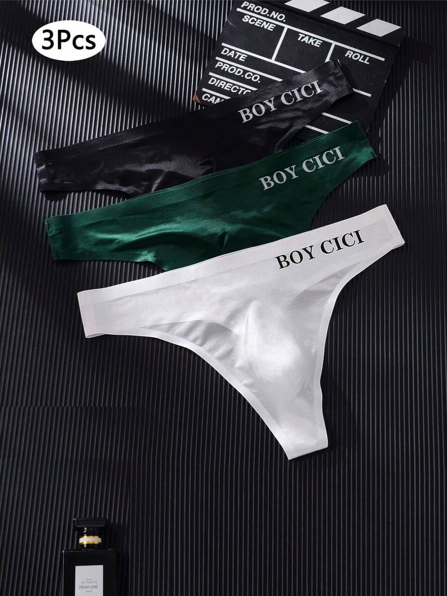 3-pack of men's multicolor low rise seamless thong underwear with letter print details in semi-sheer knitted fabric.