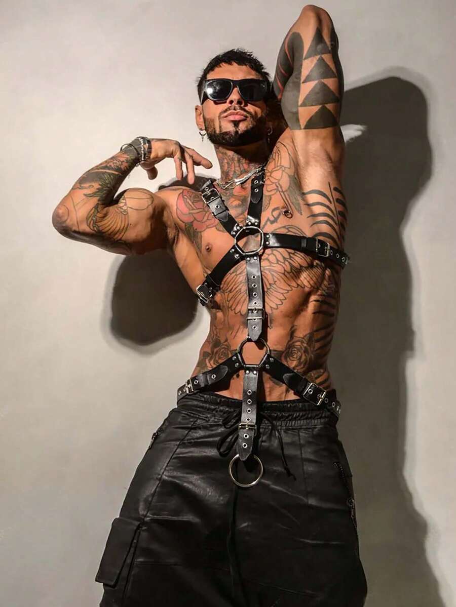 Black PU leather chest harness for men with adjustable straps, rivet details, and a metal O-ring back design.