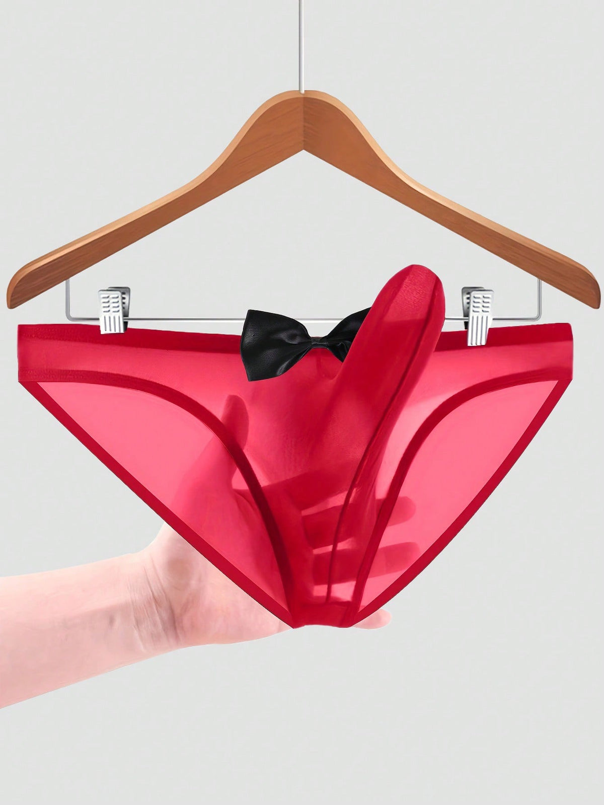 Men's sheer mesh triangle briefs in solid color featuring a mid-rise waist and breathable knitted stretch fabric.