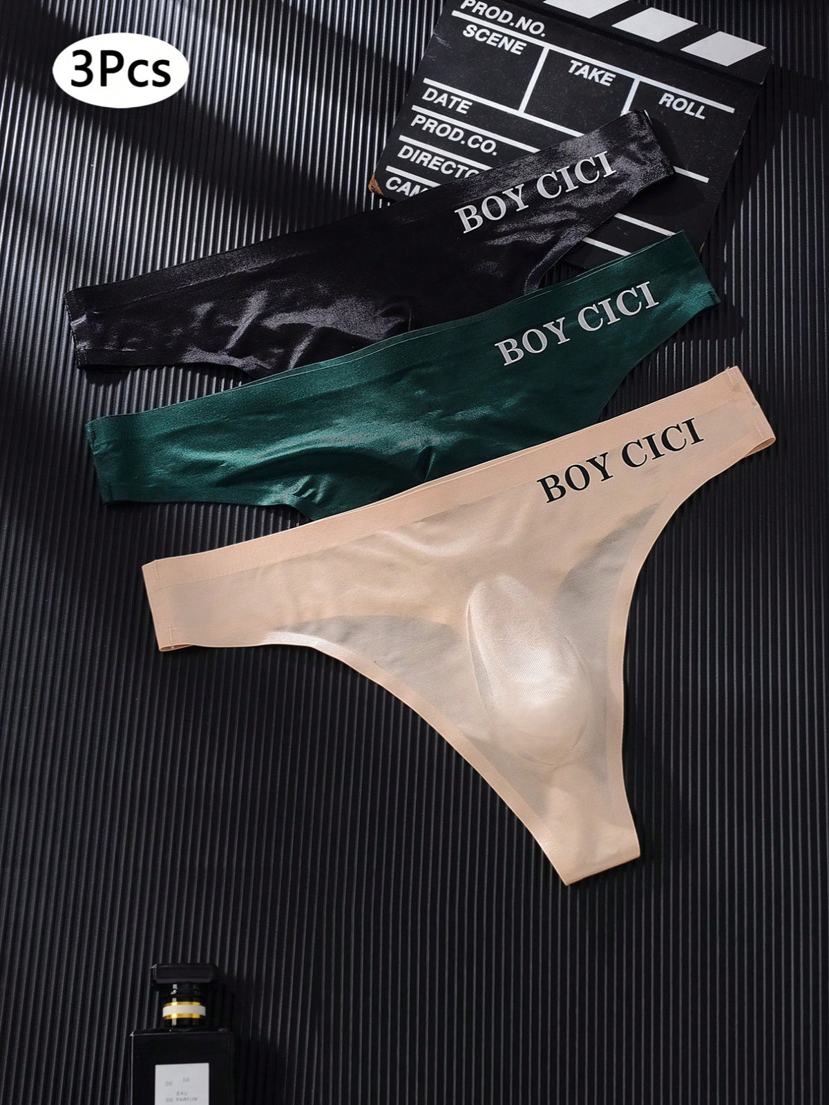 3-pack of men's multicolor low rise seamless thong underwear with letter print details in semi-sheer knitted fabric.