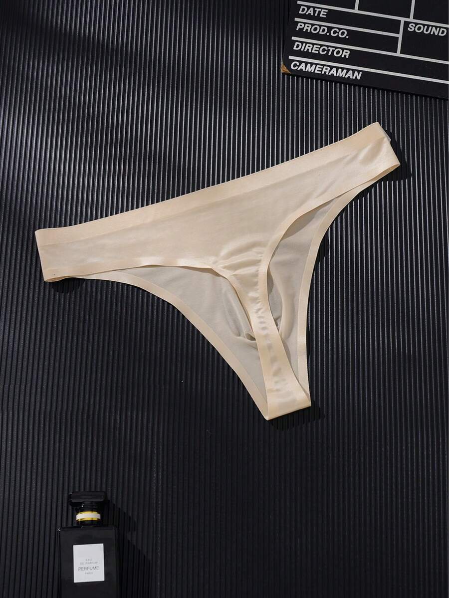 3-pack of men's multicolor low rise seamless thong underwear with letter print details in semi-sheer knitted fabric.
