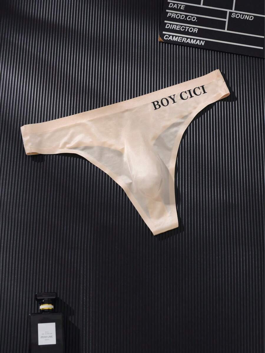 3-pack of men's multicolor low rise seamless thong underwear with letter print details in semi-sheer knitted fabric.
