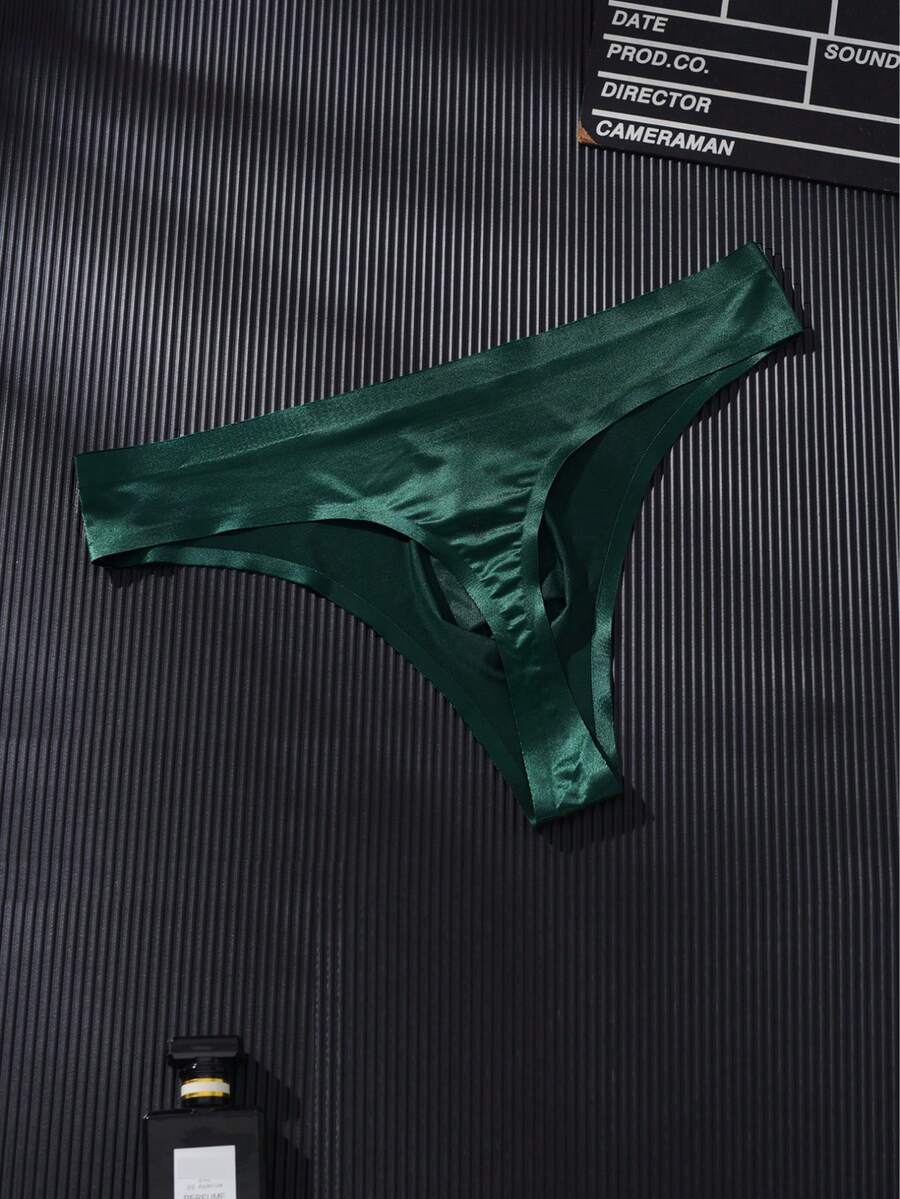 3-pack of men's multicolor low rise seamless thong underwear with letter print details in semi-sheer knitted fabric.