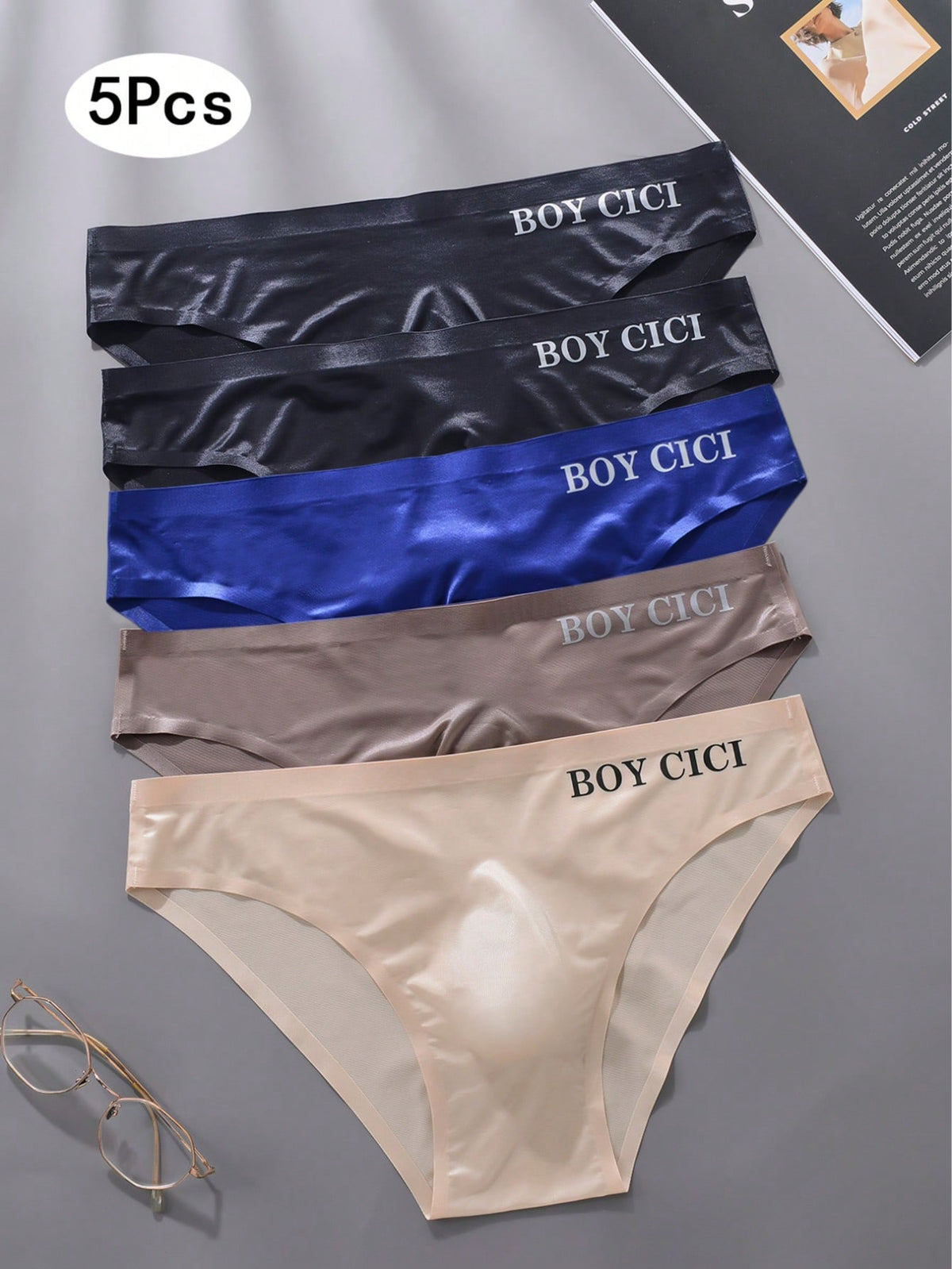 Pack of 5 men's low rise triangle briefs in sporty multicolor plain design made from lightweight stretch fabric.