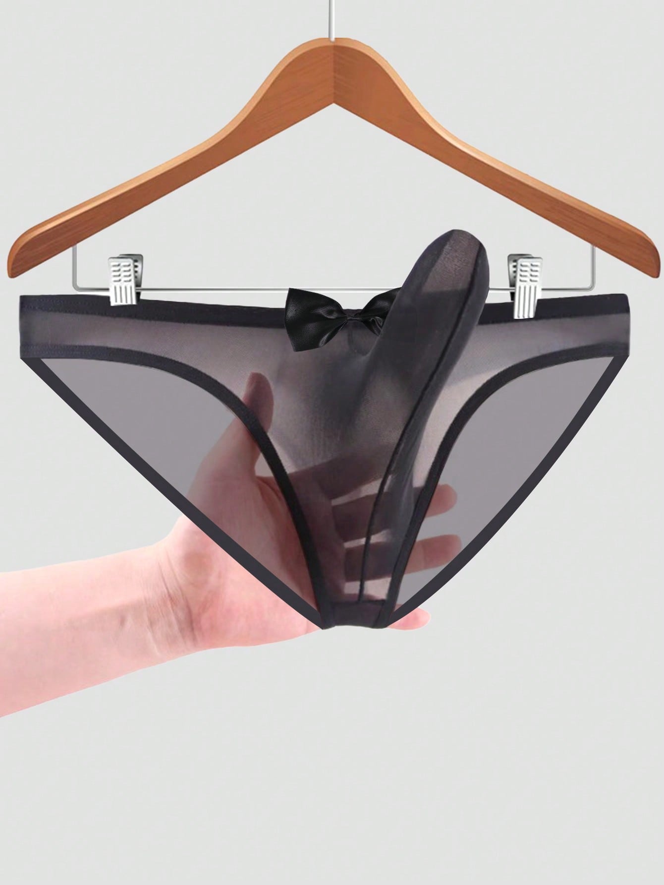 Men's solid color triangle mesh briefs with a large pouch, mid-rise waist, and breathable stretch polyamide fabric for daily wear.