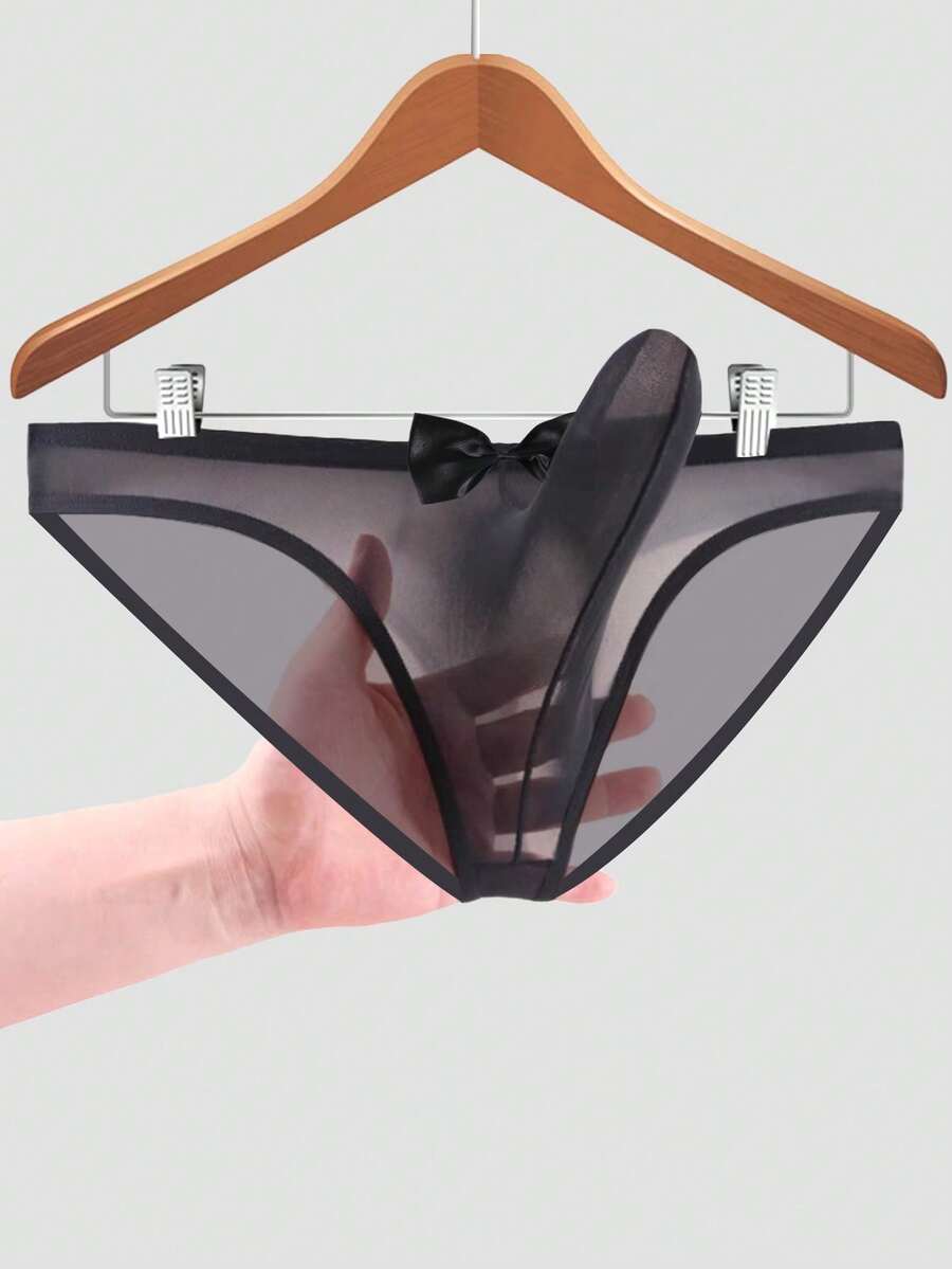 Men's sheer mesh triangle briefs in solid color featuring a mid-rise waist and breathable knitted stretch fabric.