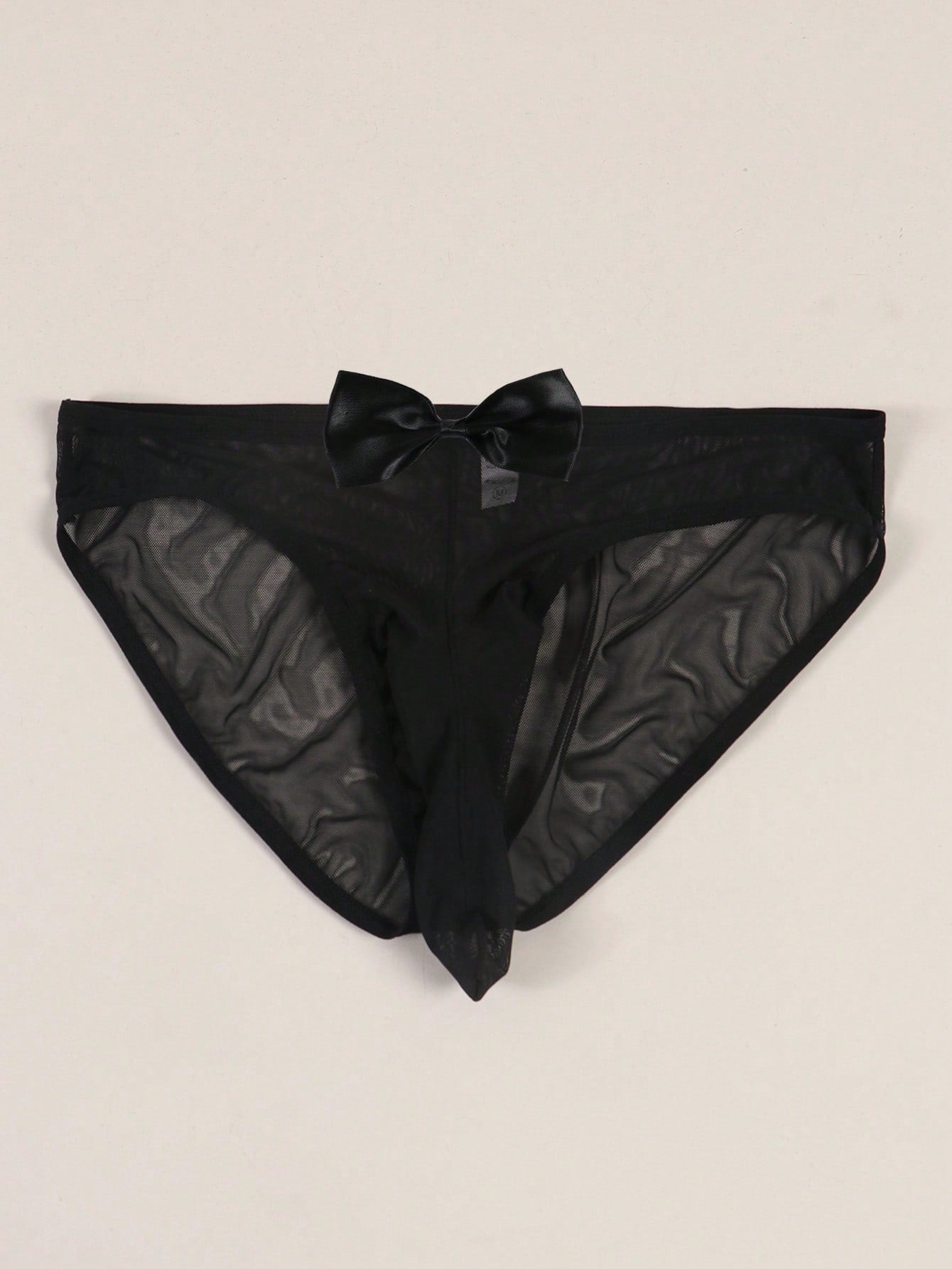 Men's solid color triangle mesh briefs with a large pouch, mid-rise waist, and breathable stretch polyamide fabric for daily wear.