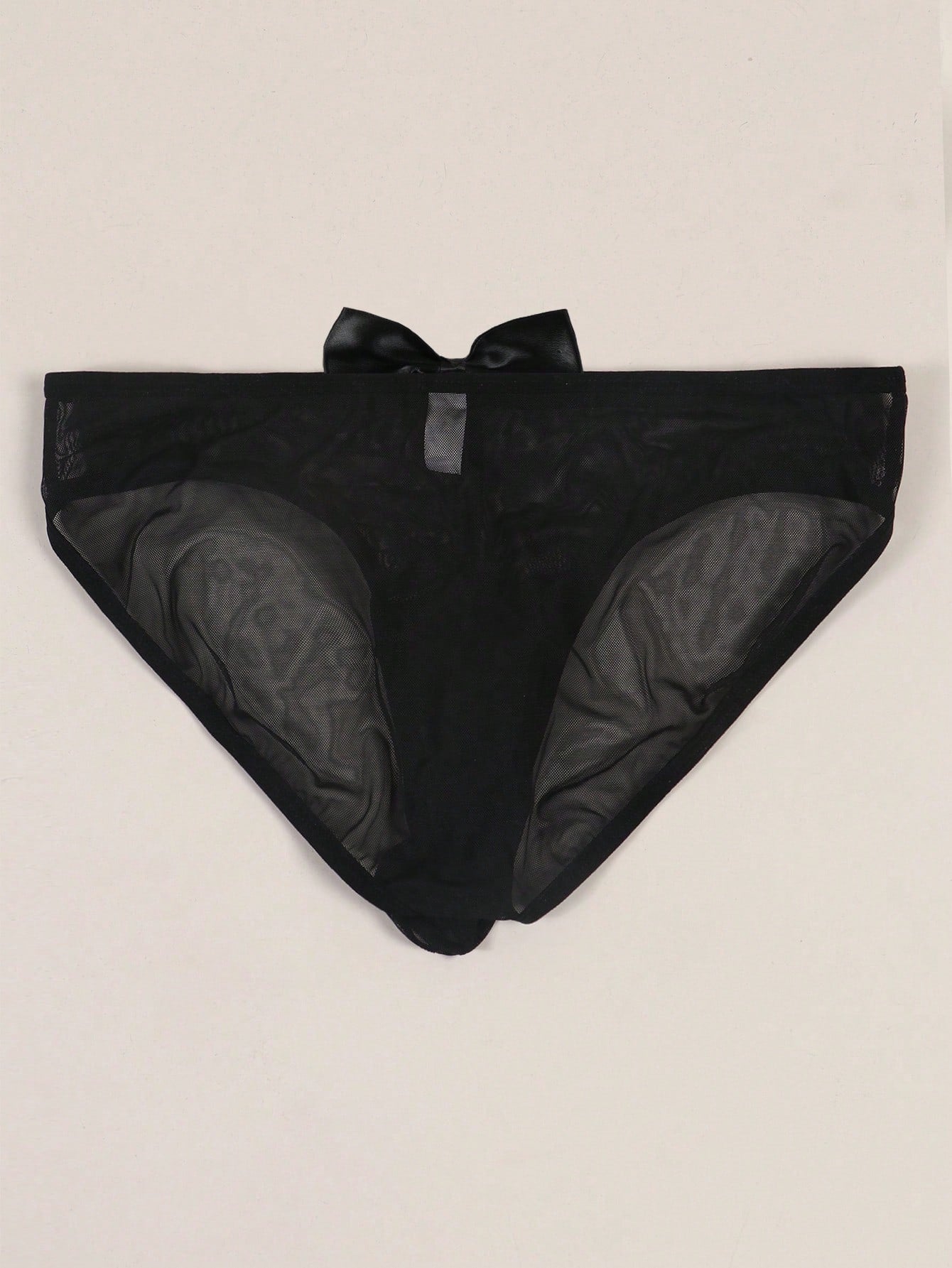 Men's solid color triangle mesh briefs with a large pouch, mid-rise waist, and breathable stretch polyamide fabric for daily wear.