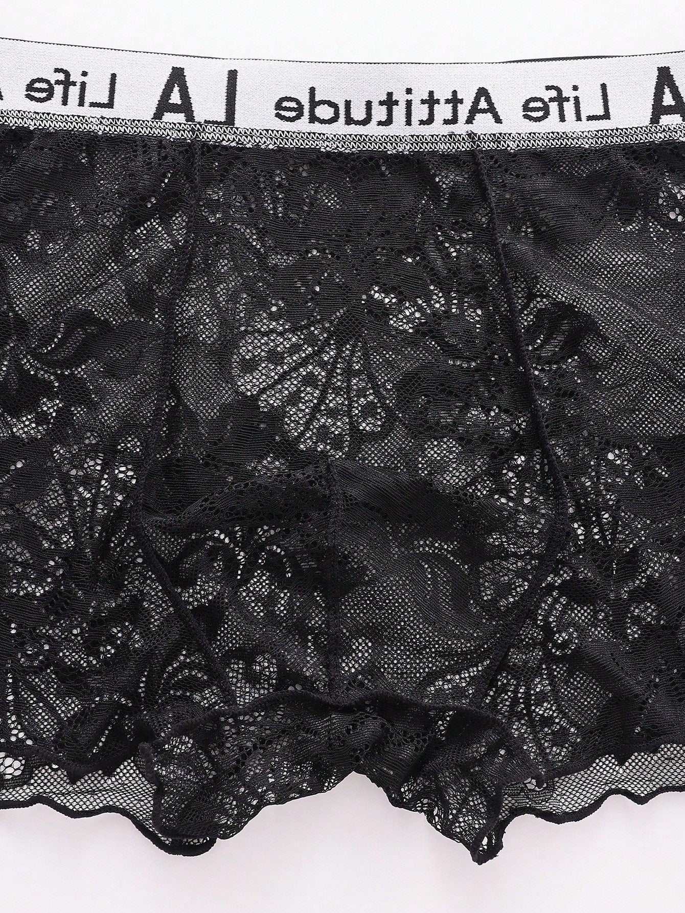 Men's black low rise lace briefs with letter waistband, semi-sheer fabric and medium stretch design.