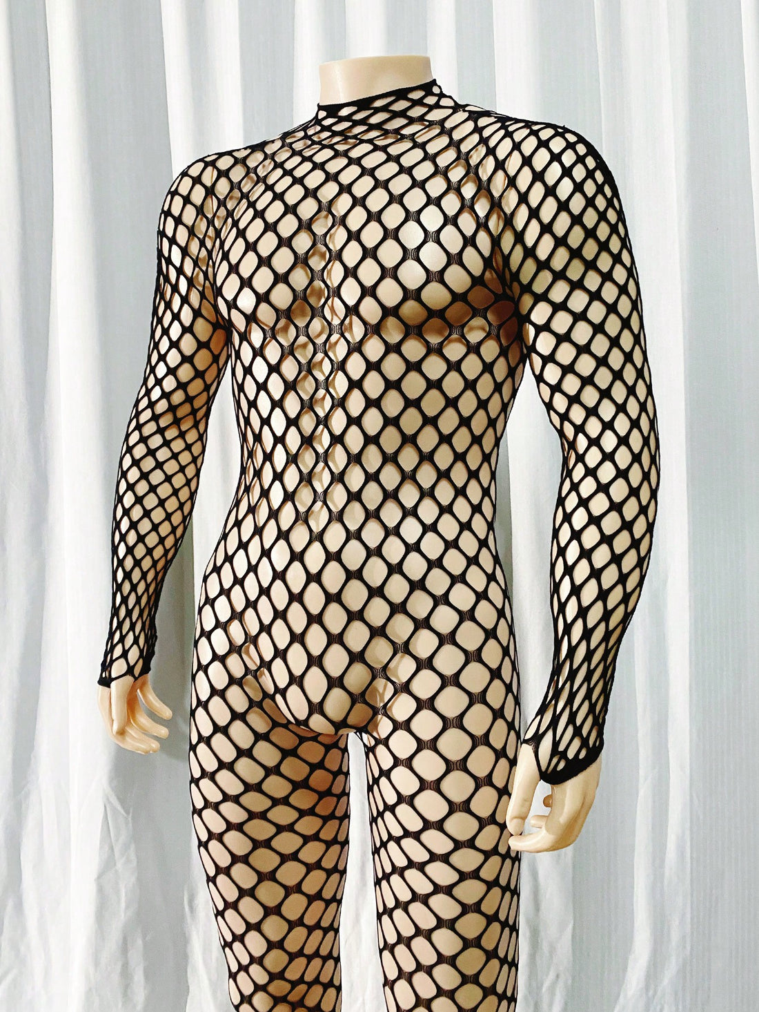 Black men's sheer bodystocking bodysuit with cut-out detail, all over print, short length, and high stretch polyamide elastane fabric.