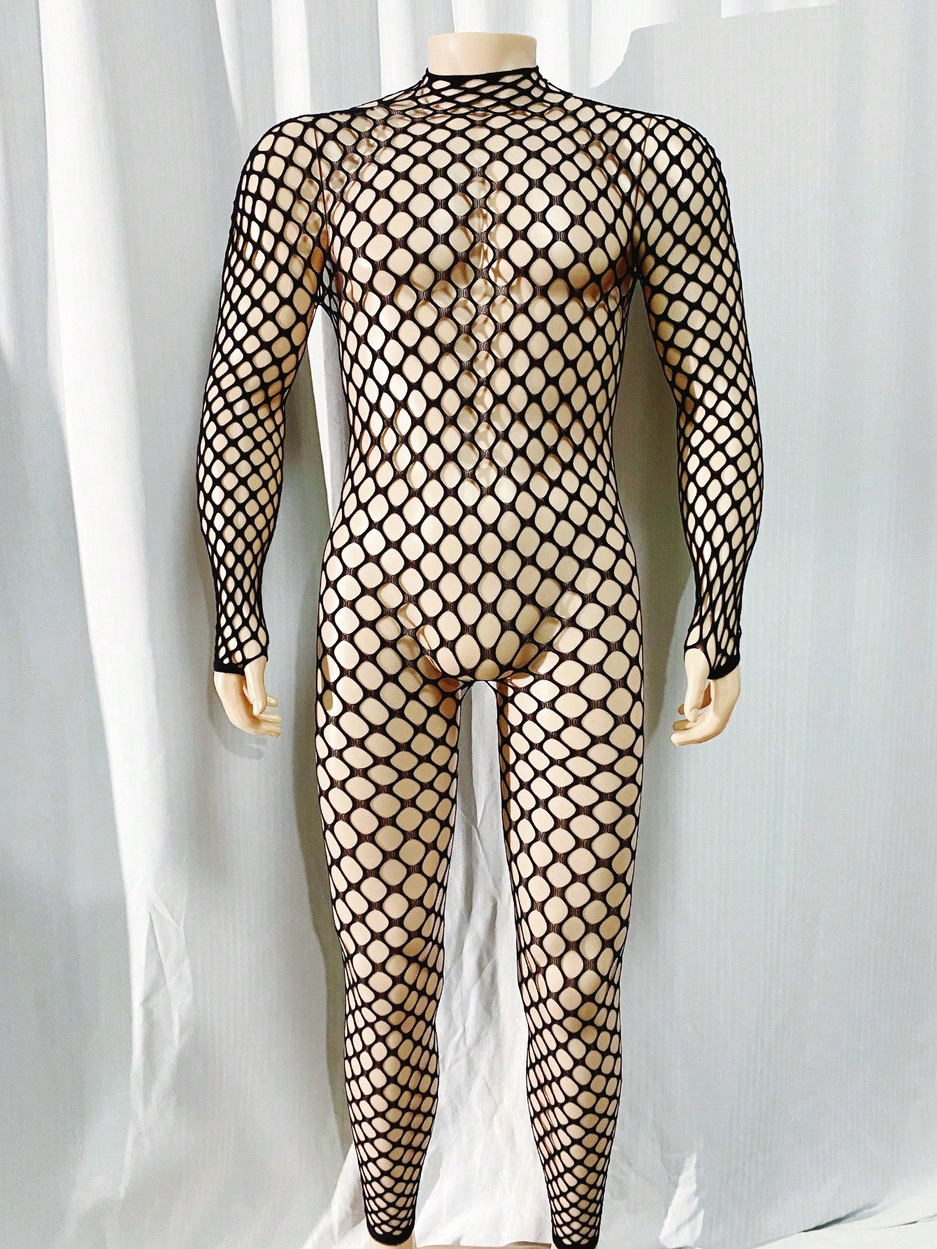 Black men's sheer bodystocking bodysuit with cut-out detail, all over print, short length, and high stretch polyamide elastane fabric.