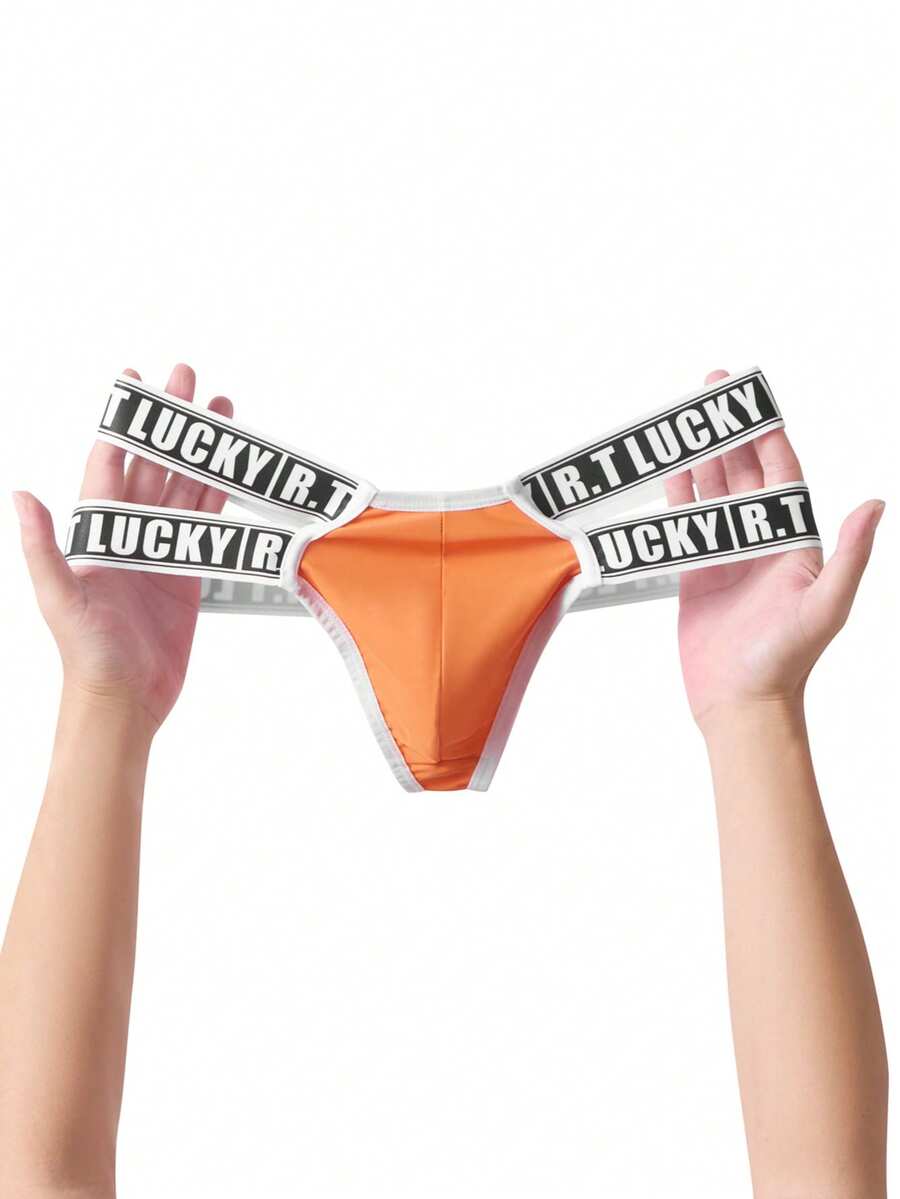 Black low-rise men's thong underwear featuring a belted waist detail and letter pattern on knitted fabric.