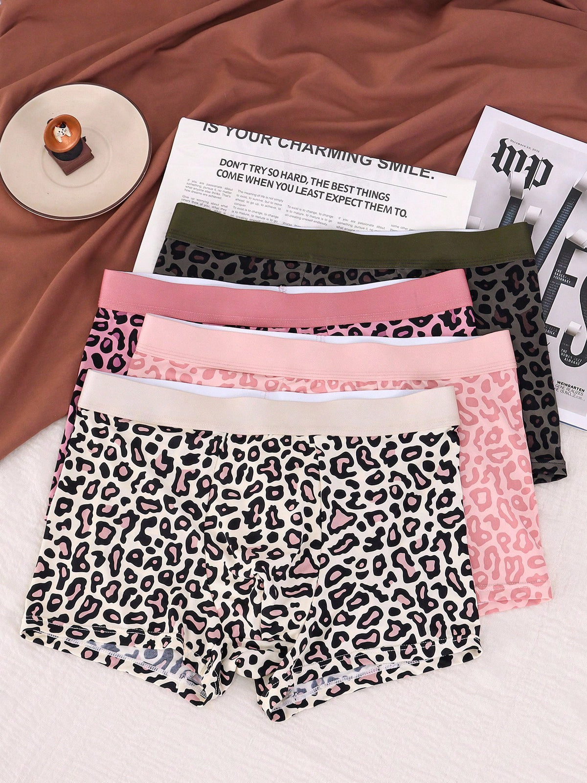 4-pack of men's multicolor leopard print boxer briefs with mid-rise elastic waistband