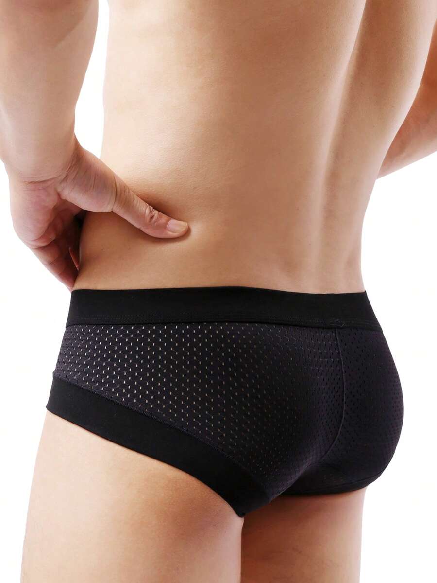 White plain men's U-convex thong underwear featuring low rise cut-out design in breathable stretch fabric.