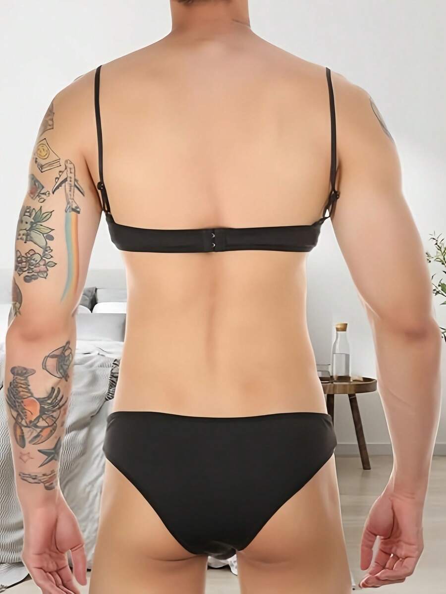 Low rise pink 2-piece briefs set with contrast lace details, backless design, deep V neck, and textured cartoon letter pattern.
