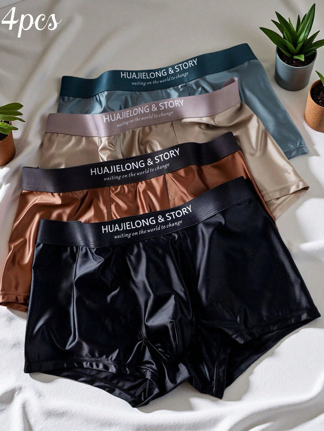 A 4-piece set of men's multicolor silk-like mid rise trunks crafted from soft knitted fabric with slight stretch and inner lining.