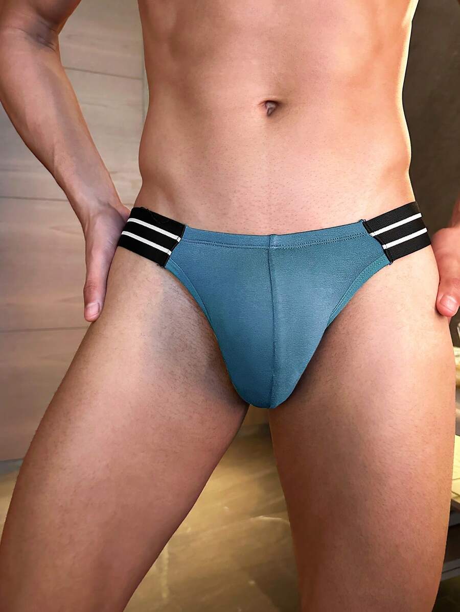 Men's low rise cut out briefs made from knitted stretch viscose fabric featuring colorblock design.