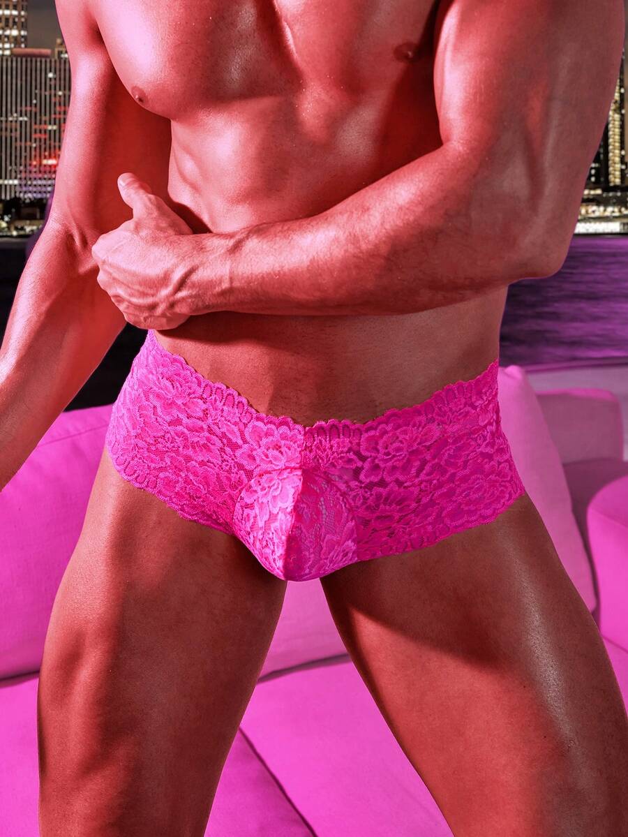 Hot pink semi-sheer low rise lace briefs for men featuring bow and contrast lace details.